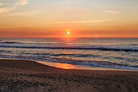 Sole al tramonto sull'oceano a Brito